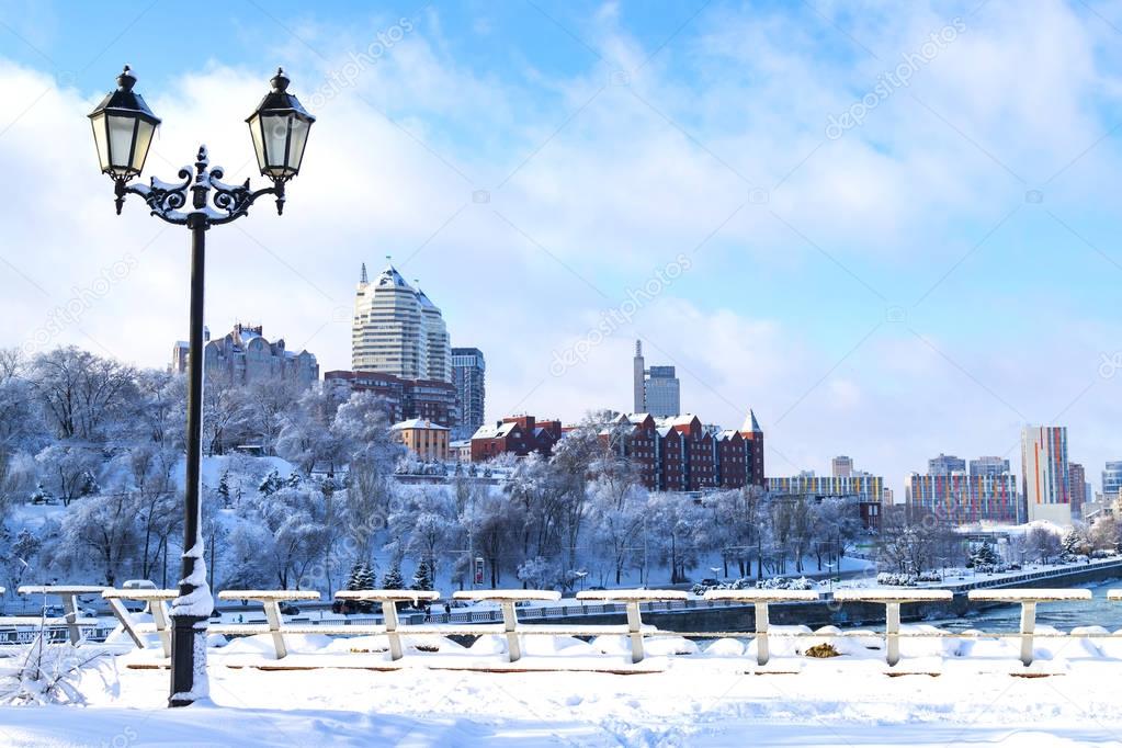 Winter landscape of the Dnipro city , covered with snow and hoarityfrost. View of the buildings,  skyscrapers  and park  from the Monastery Island. Ukraine (Dnepropetrovsk, Dnepr,  Dnipropetrovsk) 