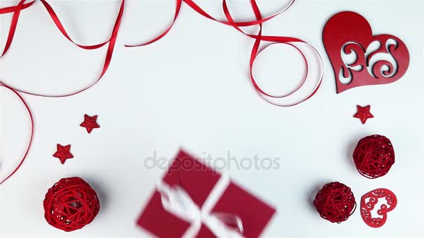 Top view hands puts envelope to Valentines Day on a white background from above — Stock Video