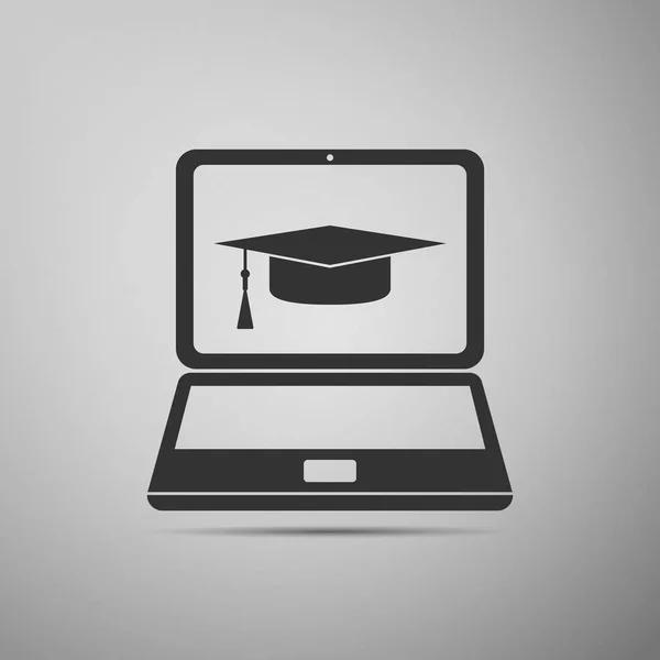 Maturitní čepici a laptop ikona. E-learning nebo ikonu pojem e-learning izolované na šedém pozadí. Plochý design. Vektorové ilustrace — Stockový vektor
