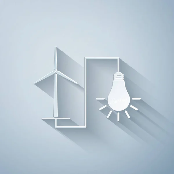 Paper cut Wind mill turbine generating power energy and glowing light bulb icon isolated on grey background. Natural renewable energy production using wind mills. Paper art style. Vector Illustration — Stock Vector