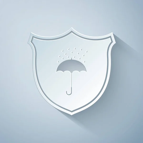 Řez papíru Vodotěsná ikona izolovaná na šedém pozadí. Štít a deštník. Ochrana, bezpečnost, koncepce zabezpečení. Symbol odolnosti vůči vodě. Papírový styl. Vektorová ilustrace — Stockový vektor