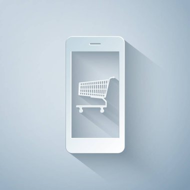 Kağıt kesiği Online alışveriş konsepti. Ekrandaki alışveriş arabası, gri arkaplanda izole edilmiş akıllı telefon simgesi. Konsept e-ticaret, e-ticaret, online iş pazarlama. Kağıt sanatı tarzı. Vektör İllüstrasyonu