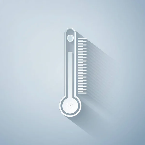 Termómetro de corte de papel con escala que mide el calor y el frío, con el sol y el icono del copo de nieve aislados sobre fondo gris. Estilo de arte de papel. Ilustración vectorial — Vector de stock