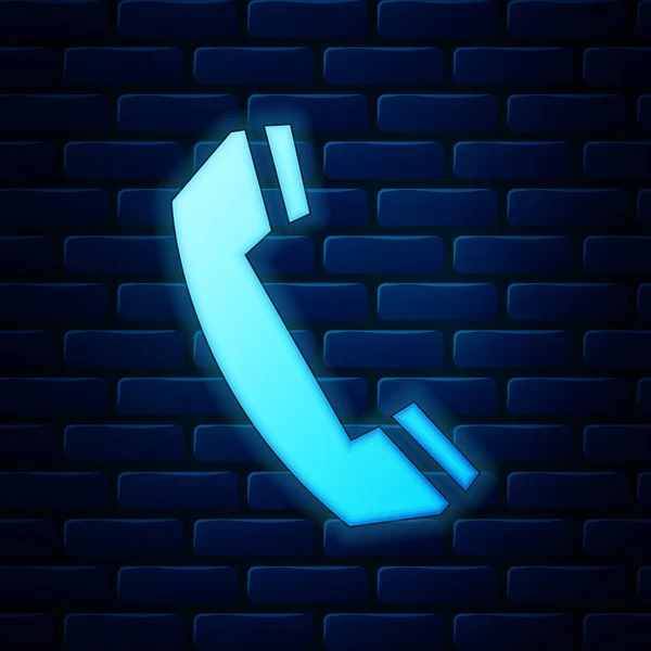 Néon brilhante Telefone ícone aparelho isolado no fundo da parede de tijolo. Sinal de telefone. Chame o símbolo do centro de suporte. Tecnologia de comunicação. Ilustração vetorial — Vetor de Stock
