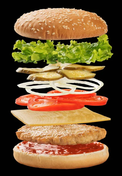 Hamburger with ingredients floating in the air