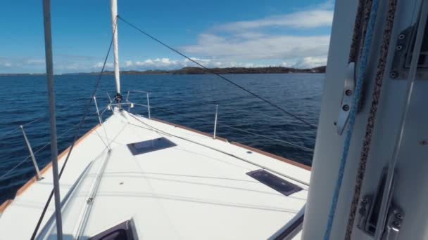 POV shot. View from the window of captains cabin. Bow of white yacht while cruising, slow motion — Stock Video