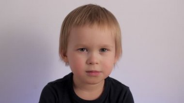 Portrait of adorable cute baby frown before laughing having fun and positive emotion