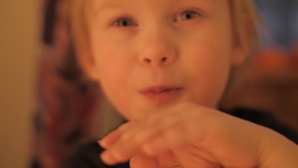 Close up portrait of cute little boy confused covering face by hands — Stok video