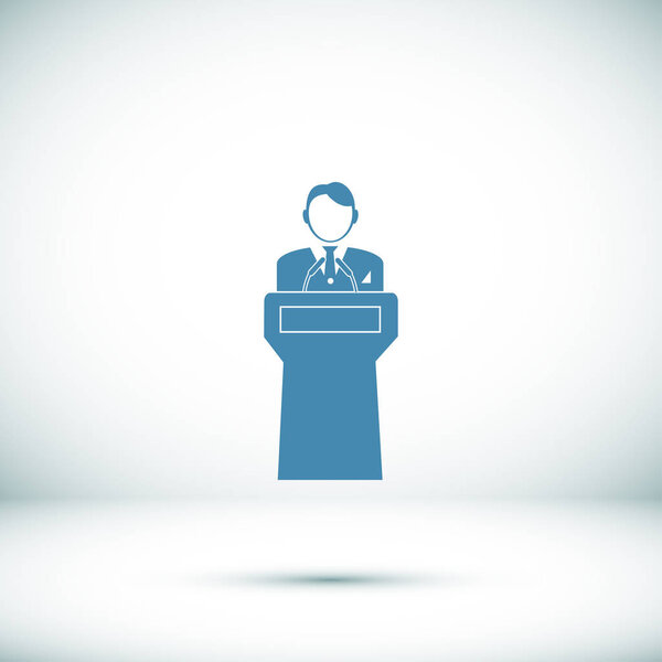  Speaker stands behind the podium