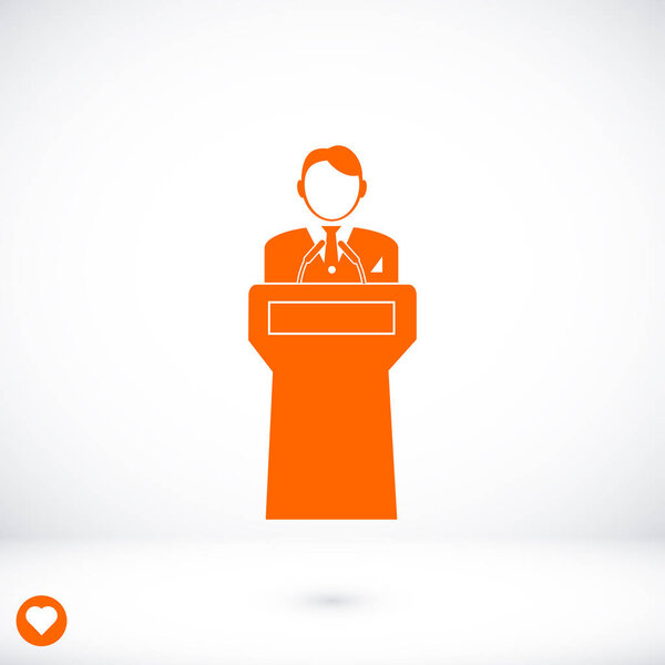  Speaker stands behind the podium