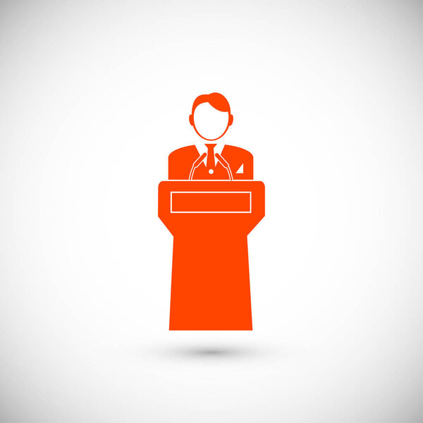  Speaker stands behind podium