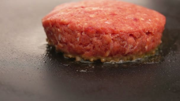 Burger is cooking on a stone grill — Stock Video