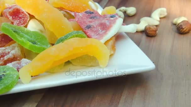 Plate of candied fruit kiwi, orange, watermelon, mango and pineapple — Stock Video