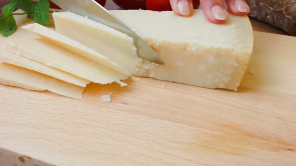 Hard French cheese cut on a board — Stock Video