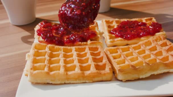 Waffles for dessert topped with jam — Stock Video