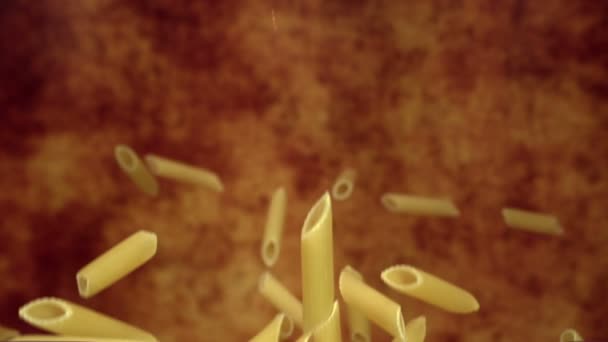 Pasta Penne bouncing in the air — Stock Video