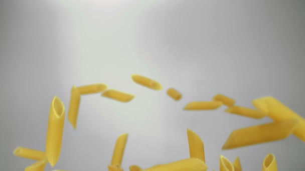 Pasta Penne bouncing in the air — Stock Video