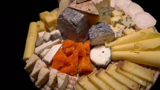 Plate of a variety of appetizing French cheeses — Stock Video