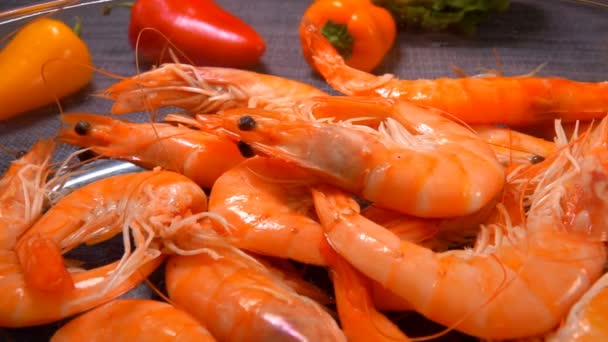 Hand takes bright juicy shrimp from a bowl — Stock Video