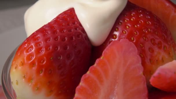 Strawberries sprinkled with fresh cream — Stock Video