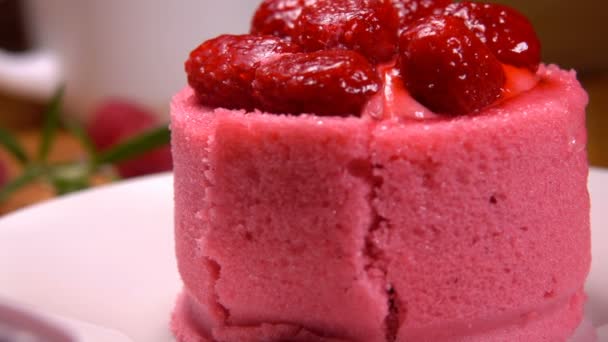 Fork takes a piece of cake with raspberry and cream — Stock Video