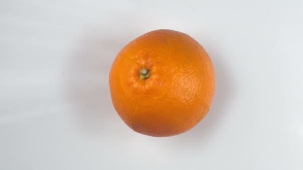 Оранжевый ломтик съемки с высокой скоростью камеры — стоковое видео