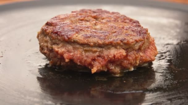 Burger is cooking on a stone grill — Stock Video