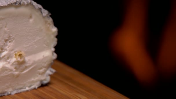 Sainte maure cheese cut on a wooden board — 비디오