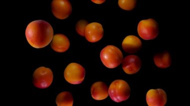 Kayısı siyah arkaplanda zıplıyor ve dönüyor