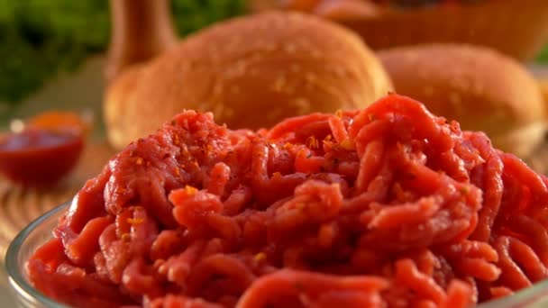 Salt and spices are falling on the minced meat — Stock Video