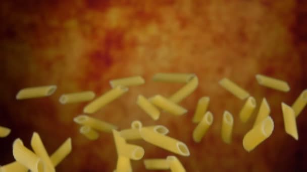 Pasta penne flies up on a yellow background — Stock Video