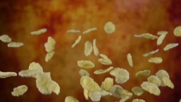 Cereal corn flakes are flying on the yellow ochre background — Stock video