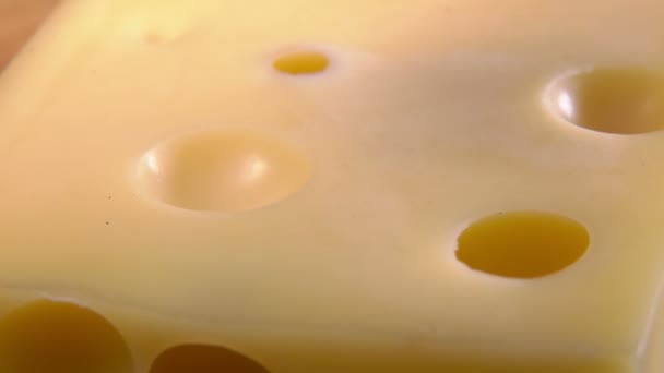 Slices of a rare black truffle mushroom are falling on the cheese — Stok video