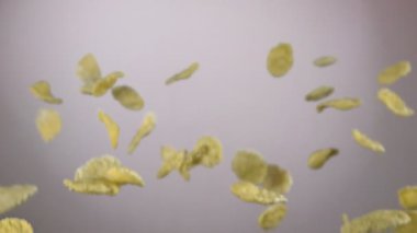 Cereal corn flakes are flying on the white background