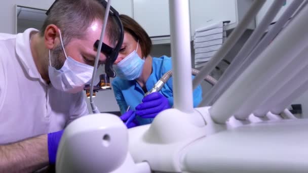 Panorama of a dentist making professional dental cleaning — Stockvideo