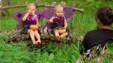 Photoshoot of little girls wearing handmade butterfly wings