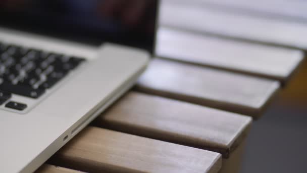 Hands writing on laptop keyboard, close up view in 4k resolution with copy space — Stock Video