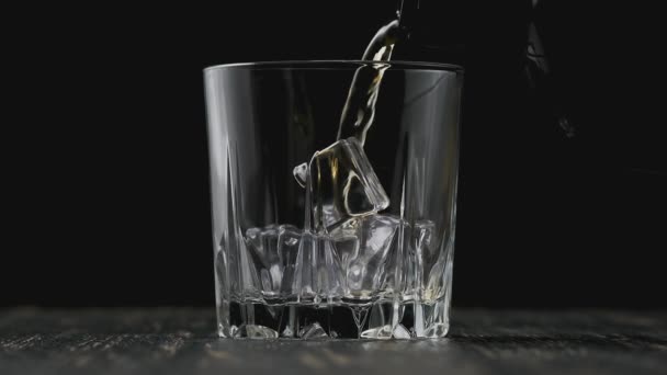 Whiskey Poured Glass Black Background Close Glass Whisky Ice Cubes — 비디오