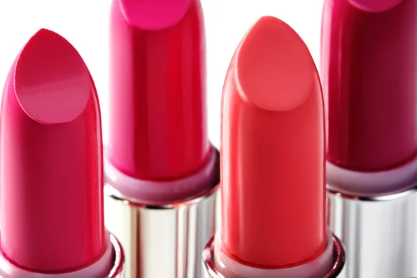 Beautiful set of lipsticks in red colors. Beauty cosmetic collection. Fashion trends in cosmetics with bright lips — Stock Photo, Image