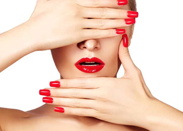 Red lips and bright manicured nails. Sexy open mouth. Beautiful manicure and makeup. Celebrate make up and clean skin Stock Picture