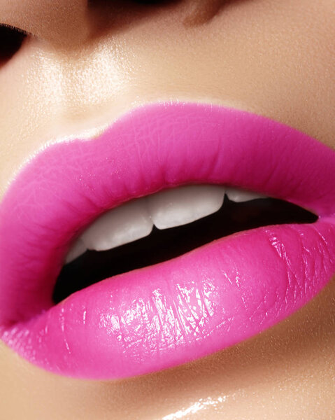 Beautiful bright Fashion Make-up on full Lips. Trend pink lip Makeup. Vivid shiny Lipgloss