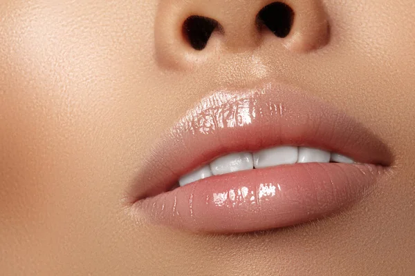 Moisturizing lip balm, lipstick. Close-up beautiful sexy wet lips. Full lips with gloss lip makeup. Filler Injections — Stock Photo, Image