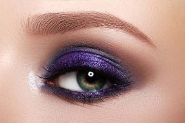 Closeup Macro of Woman Face with Purple Eyes Makeup. Fashion Celebrate Makeup, Glowy Clean Skin, perfect Shapes of Brows clipart