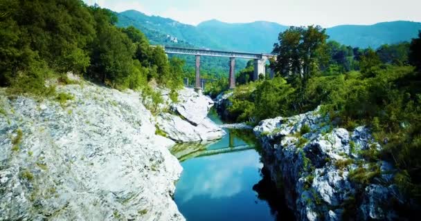 Aerial cinematic flight over a river between rocks — Stock Video