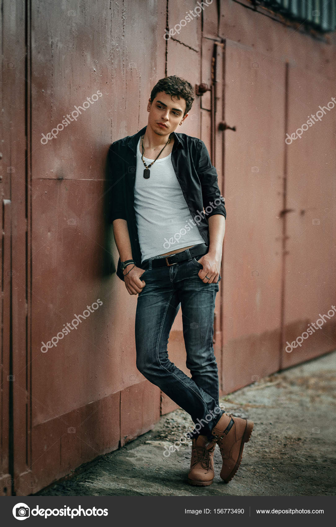 Young man in rock style Stock Photo by © 156773490
