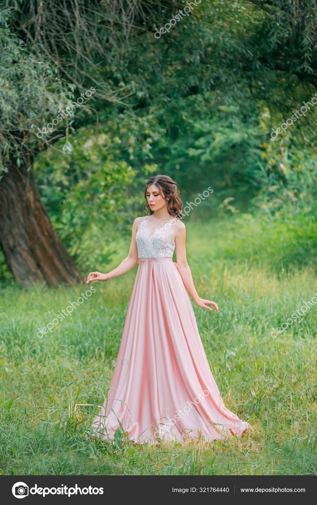 Cute attractive brunette woman enjoying nature in delicate elegant