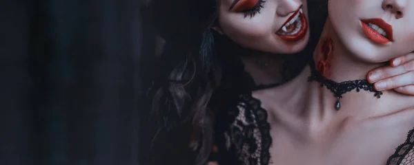 Artwork close up portrait evil medieval vampire woman bites tender cute girl princess. Drop blood red sexy lips. Bloody scary wound bite on neck. Womans Vampire mouth teeth fangs. Horror bloddy kiss — Stock Photo, Image