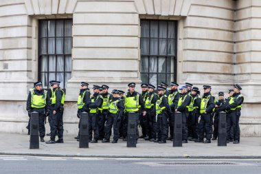 London, UK - 1st April, 2017: Police stand guard on Whitehall st clipart