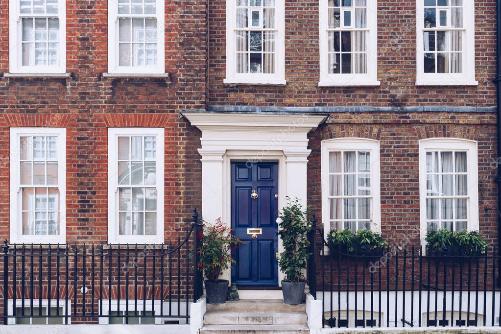 Typical street scene in the central London district with familia