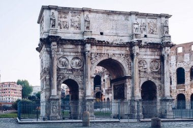 Arch of Constantine and coliseum in background at Rome, Italy clipart